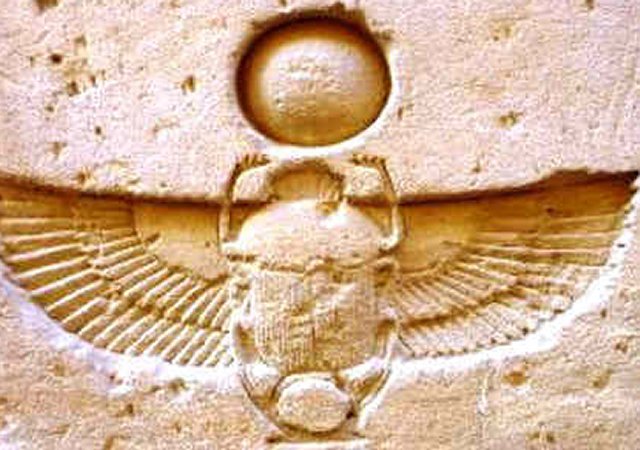 What is the symbolic meaning of a scarab beetle?