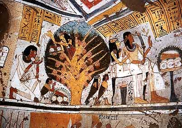 A scene from the tomb which shows Panehsy and his wife before a table of offerings, Panehsy is shown again on the left kneeling in front of tree goddess who is giving him food and drink