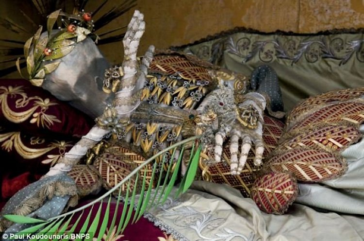 Lounging louche: aSt Vincentus' ribs are exposed beneath a web of golden leaves In Stams, Austria. Mr Koudounaris' new book, Heavenly Bodies: Cult Treasures and Spectacular Saints from the Catacombs, is the first time the skeletons have appeared in print.