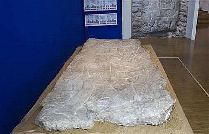 A 2-meter-high, several thousand-year-old sculpture is pictured at the Mexican Cultural institute of Paris, France, Thursday, Sept. 24, 2015. The sculpture was handed to Mexican authorities 45 years after it disappeared from Mexico. The Olmec stella was recently re-discovered France. (AP Photo/Jacques Brinon)