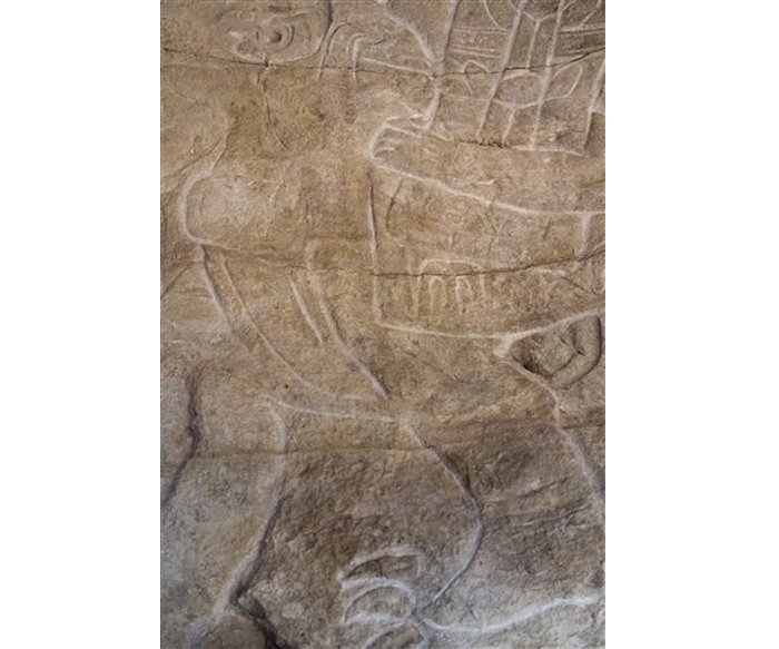 A detail of a 2-meter-high, several thousand-year-old sculpture is pictured at the Mexican Cultural institute of Paris, France, Thursday, Sept. 24, 2015. The sculpture was handed to Mexican authorities 45 years after it disappeared from Mexico. The Olmec stella was recently re-discovered France. (AP Photo/Jacques Brinon)