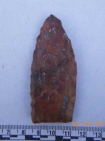 This biface blade, fashioned in the Clovis style from local jasper, was found near the surface on the Marine Corps Air Ground Combat Center, and is thought by archaeologists to be around 13,000 years old. (Courtesy Far Western/MCAGCC)