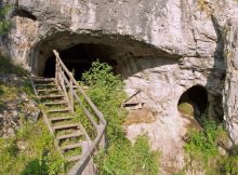 The entrance to Denisova Cave in Siberia, where evidence of a mysterious branch of the human tree was discovered. Credit Bence Viola