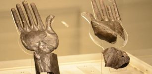 Silver hands in ancient tomb