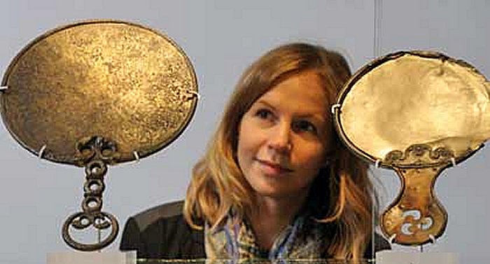 British Museum Project Co-ordinator Natalie Tacq admires the 2,000-year-old Holcombe (left) and Balmaclellan mirrors © Richard Darn