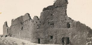 This photo from the 1930s shows the back wall of Pueblo Bonito, the largest structure found in Chaco Canyon, New Mexico. Archaeologists estimate the intact structure was five stories high and had about 500 rooms. UA tree-ring studies of the building's wooden beams revealed the structure was built in phases from 850 to 1120. (Photo: George A. Grant/ National Park Service)