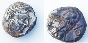Two silver coins, onebearing the likeness of the goddess Athena and the other depicts the Athenian owl. Credits: Israel Antiquities Authority