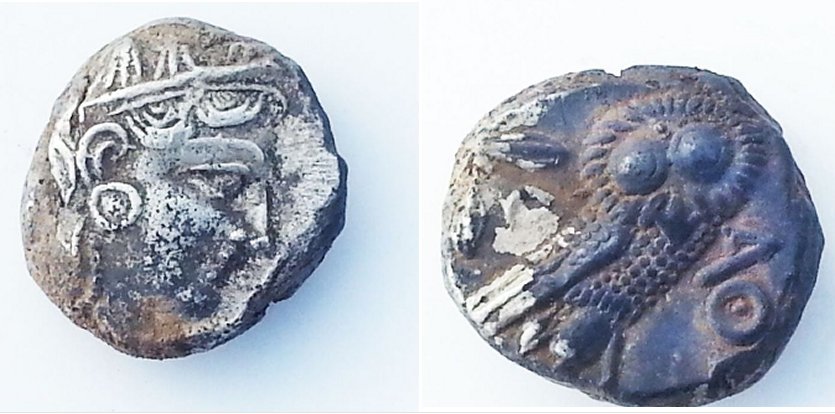 Two silver coins, onebearing the likeness of the goddess Athena and the other depicts the Athenian owl. Credits: Israel Antiquities Authority