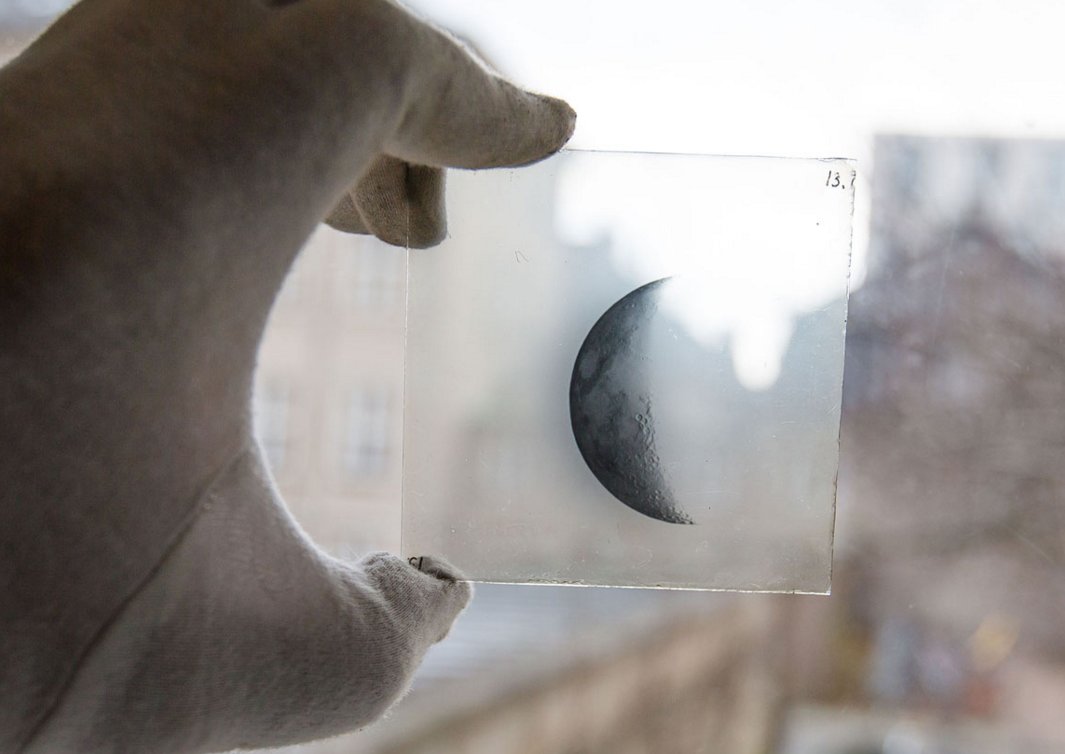 A collection of glass plates from 1909-1922 show the Moon in different phases. Credits: Niels Bohr Institute