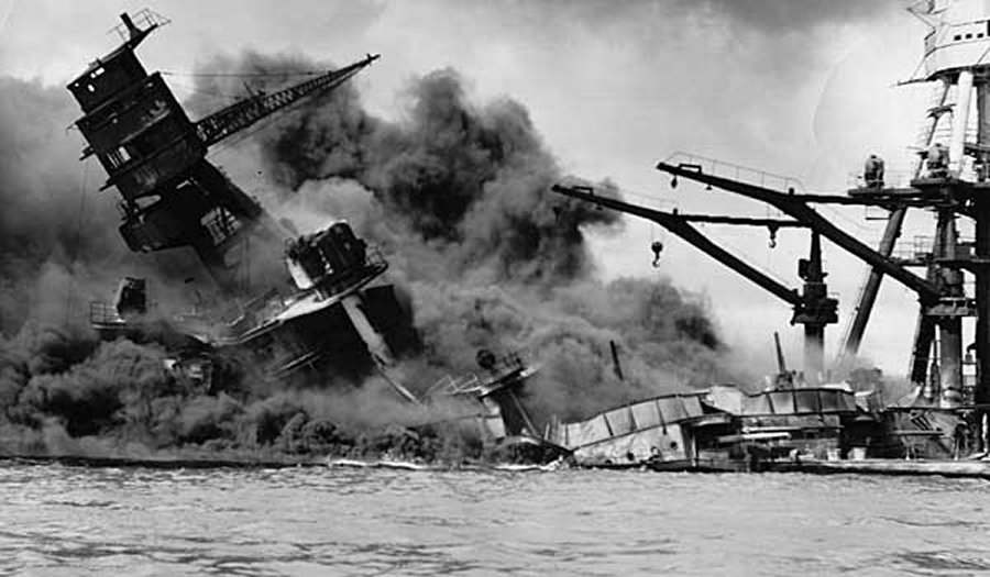 A U.S. battleship sinks during the Japanese attack on Pearl Harbor, Hawaii, in 1941. Credits: National Archives, Washington, D.C.