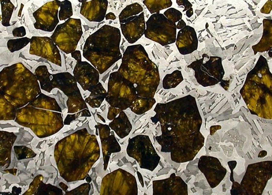 The Fukang's polished face provides a window into its wondrous mosaic of extraterrestrial crystals. It's an astounding treasure - a phenomenal and prestigious centerpiece for any natural history exhibit. Image credit: Southwest Meteorite Laboratory