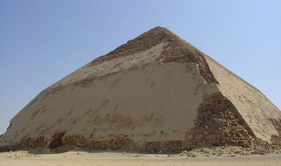 The Bent Pyramid in Dahshur, just outside Cairo, is distinguished by the bent slope of its sides. It is believed to have been ancient Egypt’s first attempt to build a smooth-sided pyramid. Credits: wikipedia