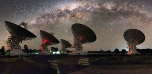 CSIRO's Compact Array in Australia is shown under the night lights of the Milky Way. Credit: Alex Cherney
