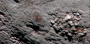 This composite image of a possible ice volcano on Pluto includes pictures taken by the New Horizons spacecraft’s Long Range Reconnaissance Imager (LORRI) on July 14, 2015, from a range of about 30,000 miles (48,000 kilometers), showing features as small as 1,500 feet (450 meters) across. Sprinkled across the LORRI mosaic is enhanced color data from the Ralph/Multispectral Visible Imaging Camera (MVIC), from a range of 21,000 miles (34,000 kilometers) and at a resolution of about 2,100 feet (650 meters) per pixel. The entire scene is 140 miles (230 kilometers) across. Image credit: NASA/JHUAPL/SwRI