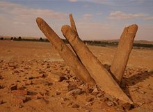 Al-Rajajil, sometimes referred to as the Standing Men, or Standing Stones are more than 6,000 years old. They have been arranged in groups of four or more in a curved manner, and joined at the base. They now lean at random angles. As a group, there are more than 30 aligned pillars weighing over 5 tons each.