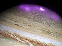 Jupiter's X-ray emission is shown in magenta and white, for the brightest spot, overlaid on a Hubble Space Telescope optical image. X-RAY: NASA/CXC/UCL/W.DUNN ET AL, OPTICAL: NASA/STSCI