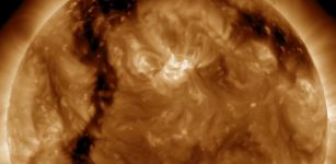 Elongated coronal hole on the surface of the Sun as seen in video. Credits NASA/SDO