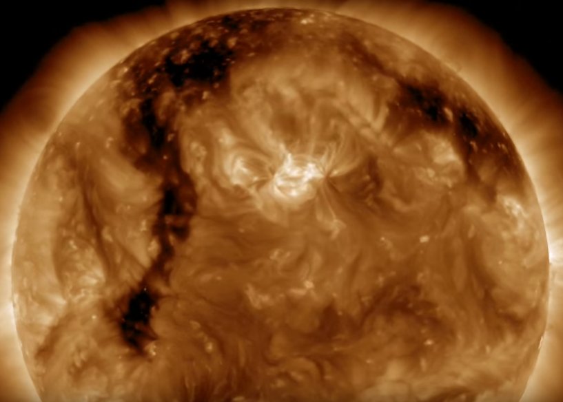 Elongated coronal hole on the surface of the Sun as seen in video. Credits NASA/SDO