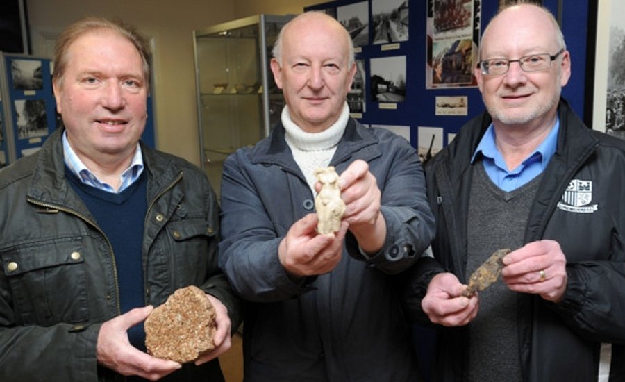 Kenneth Dodd, John Broughton and John Nunn are pictured with the finds from the recent dig. Credits: East Anglian Daily Times;