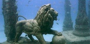 A lion statue standing underwater.