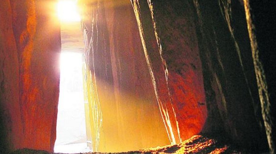 Sunlight passes along the passageway leading to the burial chamber at Newgrange during the winter solstice. Photo credits: A. Betson via irishtimes.com