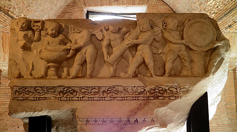 Frieze-archivatre representing Cupids, from the first order of the cells internal decoration from. Image via Wikipedia