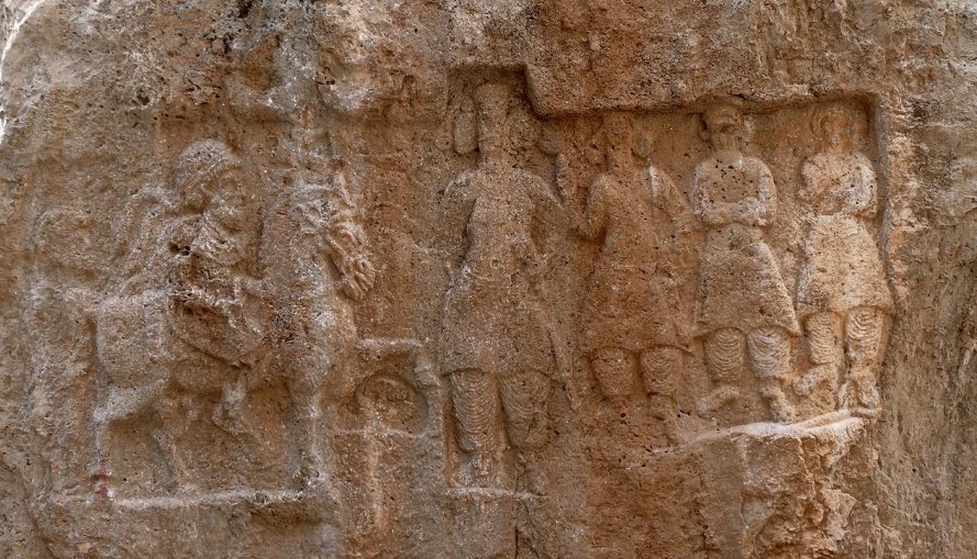 A rock-carved relief of Mithridates I of Parthia (r. c. 171–138 BC), seen riding on horseback. Image via Wikipedia