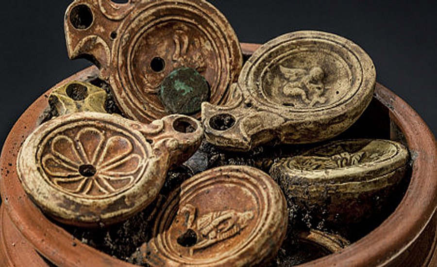 Each lamp is decorated with an image, including the moon goddess Luna, a gladiator, a lion, a peacock and an erotic scene. Image credit: Photo: Aargau canton archeology department