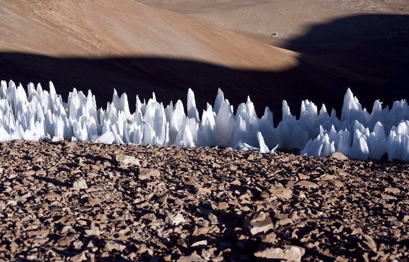 An example of the penitentes from the southern end of the Chajnantor plain in Chile. Though these ice formations only reach a few feet in height, while Pluto’s bladed terrain reaches hundreds of feet, they both have similar sharp ridges. Credits: Wikimedia Commons/ESO
