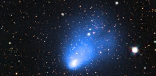 This picture of the galaxy cluster ACT-CL J0102−4915 combines images taken with ESO’s Very Large Telescope with images from the SOAR Telescope and X-ray observations from NASA’s Chandra X-ray Observatory. The X-ray image shows the hot gas in the cluster and is shown in blue. This newly discovered galaxy cluster has been nicknamed El Gordo — the "big" or "fat one" in Spanish. It consists of two separate galaxy subclusters colliding at several million kilometres per hour, and is so far away that its light has travelled for seven billion years to reach the Earth. Credit: ESO/SOAR/NASA