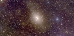 Centaurus A, an elliptical galaxy 13 million light-years from Earth, hosts a group of dwarf satellite galaxies co-rotating in a narrow disk, a distribution not predicted by dark-matter-influenced cosmological models. Credit: Christian Wolf and the SkyMapper team / Australian National University