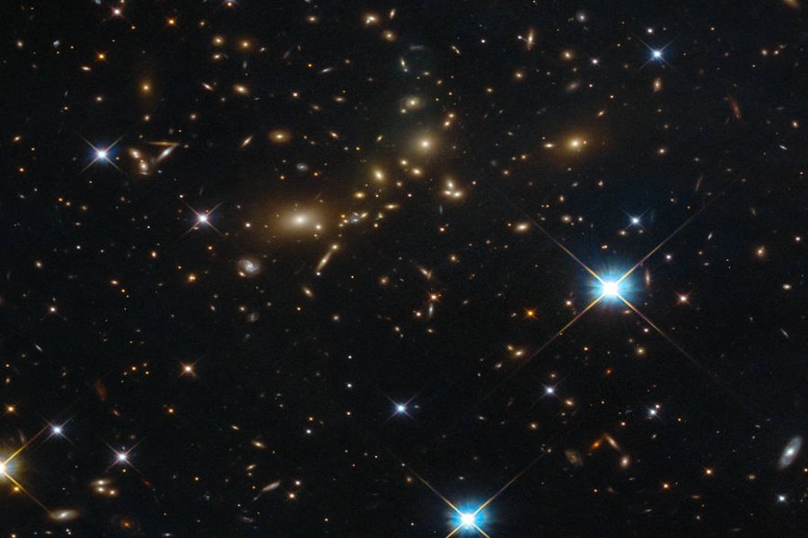 NASA/ESA Hubble Space Telescope image shows a massive galaxy cluster glowing brightly in the darkness. Despite its beauty, this cluster bears the distinctly unpoetic name of PLCK G308.3-20.2. Image credit: ESA/Hubble & NASA, RELICS