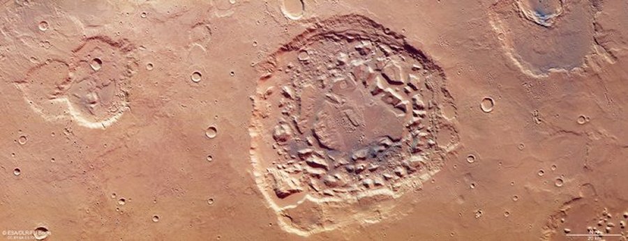 Mars Express view of Ismenia Patera. This crater lies within Arabia Terra, an intriguing part of Mars’ surface thought to have once hosted significant volcanic activity. Scientists remain unsure of exactly how Ismenia Patera formed; it may be the result of a meteorite smashing into the surface of Mars and forming an impact crater, or the collapsed remnants of a once-massive supervolcano. ' Image credit: ESA/DLR/FU Berlin