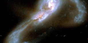 The colliding galaxy pair VV705. Astronomers have measured a set of merging galaxies to determine the relative contributions to luminosity from star formation versus from accretion around the supermassive black hole nucleus. For VV705, they find that nearly 75% of the luminosity comes from star formation. Credit: NASA/Hubble