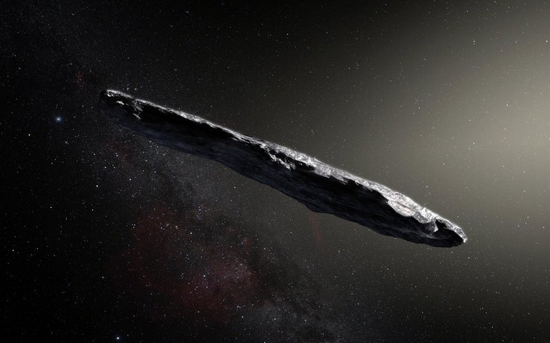 Artist’s impression oft he interstellar object ‘Oumuamua. The object is either elongated as in this image, or else shaped like a pancake. Image: ESO/M. Kornmesse