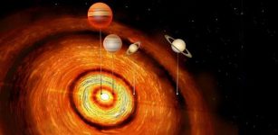 Researchers have identified a young star with four Jupiter and Saturn-sized planets in orbit around it, the first time that so many massive planets have been detected in such a young system.