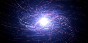 Electrons (blue) and positrons (red) from a computer-simulated pulsar. These particles become accerlated to extreme energies in a pulsar's powerful magnetic and electric fields; lighter tracks show particles with higher energies. Each particle seen here actually represents trillions of electrons or positrons. Better knowledge of the particle environment around neutron stars will help astronomers understand how they behave like cosmic lighthouses, producing precisely timed radio and gamma-ray pulses. Credit: NASA's Goddard Space Flight Center