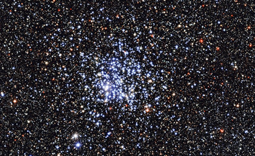 An image of the Wild Duck Cluster was captured by the MPG/ESO 2.2-metre telescope at the La Silla Observatory in Chile. The blue stars at the center of the image are the stars of the cluster. Every star in the Wild Duck Cluster is roughly 250 million years old. Older, redder stars surround the cluster. (Image: European Southern Observatory)
