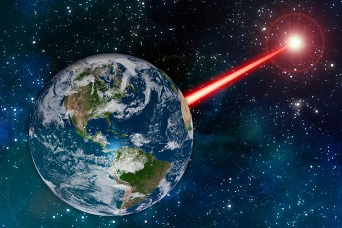 An MIT study proposes that laser technology on Earth could emit a beacon strong enough to attract attention from as far as 20,000 light years away. Image: MIT News