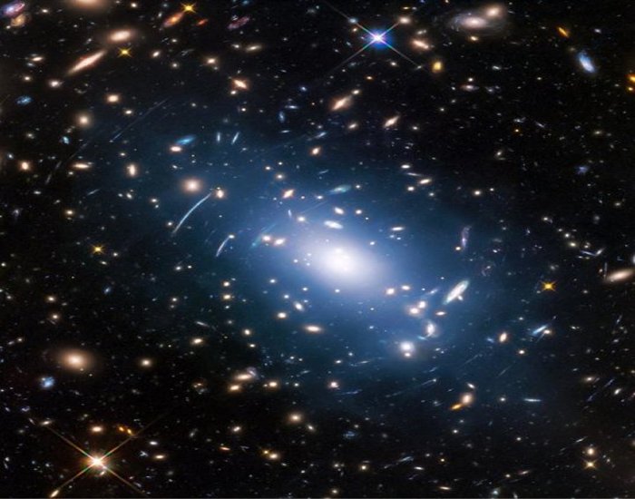 Abell S1063, a galaxy cluster, was observed by the NASA/ESA Hubble Space Telescope as part of the Frontier Fields program. The huge mass of the cluster -- containing both baryonic matter and dark matter -- acts as cosmic magnification glass and deforms objects behind it. In the past astronomers used this gravitational lensing effect to calculate the distribution of dark matter in galaxy clusters.