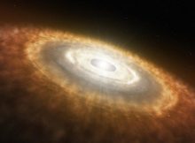 Artist’s impression of a young star surrounded by a protoplanetary disk in which planets are forming. Based on measures of neon isotopes, UC Davis researchers conclude that the Earth formed relatively quickly from this cloud of dust and gas, collecting water, carbon and nitrogen in the deep Earth. (European Southern Observatory)