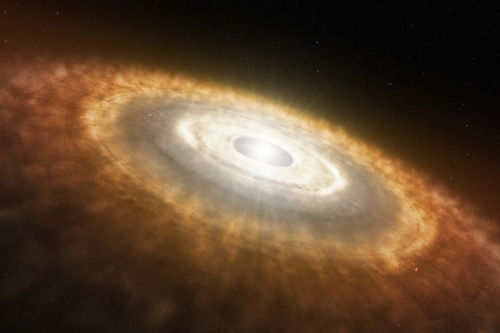 Artist’s impression of a young star surrounded by a protoplanetary disk in which planets are forming. Based on measures of neon isotopes, UC Davis researchers conclude that the Earth formed relatively quickly from this cloud of dust and gas, collecting water, carbon and nitrogen in the deep Earth. (European Southern Observatory)