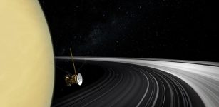 Artist’s concept of the Cassini orbiter crossing Saturn’s ring plane. Credit: NASA/JPL-Caltech image