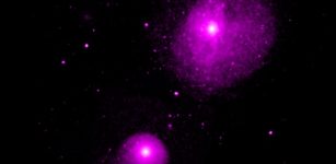This image from NASA's Chandra X-ray Observatory shows the region around NGC 1399 and NGC 1404, two of the largest galaxies in the Fornax galaxy cluster. Located at a distance of about 60 million light years, Fornax is one of the closest galaxy clusters to Earth. This relative proximity allows astronomers to study the Fornax cluster in greater detail than most other galaxy clusters.