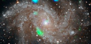 This visible-light image of the Fireworks galaxy (NGC 6946) comes from the Digital Sky Survey, and is overlaid with data from NASA's NuSTAR observatory (in blue and green). Credit: NASA/JPL-Caltech