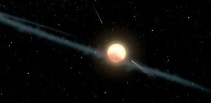 A new study suggests that chunks of an exomoon’s dusty outer layers of ice, gas, and carbonaceous rock may be accumulating in a disk surrounding Tabby’s Star, blocking the star’s light and making it appear to gradually fade. (Photo: NASA/JPL-Caltech)