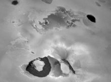 This picture from Voyager 1 shows the volcano Loki on Jupiter’s moon Io. When this picture was taken, the main eruptive activity came from the lower left of the dark linear feature (perhaps a rift) in the center. Below is the "lava lake," a U-shaped dark area about 200 kilometers across. Credit: NASA/JPL