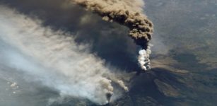 An eruption at Mount Etna on October 30, 2002 from the International Space Station. The eruption, triggered by a series of earthquakes, was one of the most vigorous in years. Ashfall was reported in Libya, more than 350 miles away. Credit: NASA