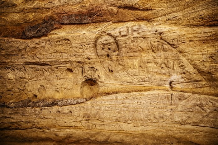 Though carving into the walls of Robber's Cave is no longer allowed, thousands of visitors have left their mark.