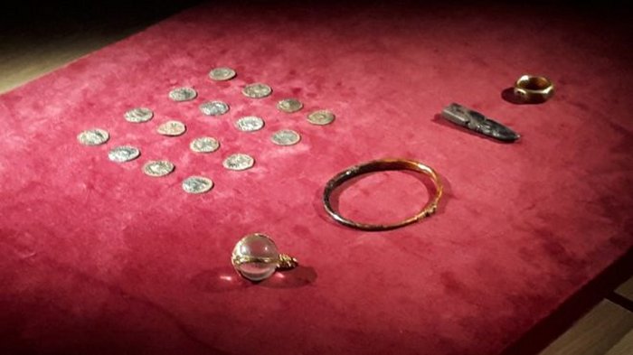 The haul included coins, a crystal pendant, a gold arm-band, silver ingot and gold finger ring. Credit: West Mercia Police